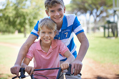 Buy stock photo Nature, smile and portrait of children on bicycle riding in outdoor field, park or forest for exercise. Happy, cycling and confident young boy kids on bike for cardio, hobby or training in a garden.