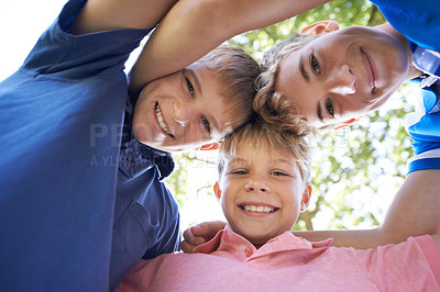 Buy stock photo Children, friends and portrait outdoor in tree nature for exploring adventure for sunshine, backyard or below. Boys, face and smile youth or playing game in woods for summer holiday, bond or social