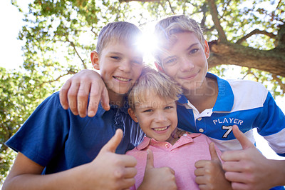 Buy stock photo Portrait, hug and thumbs up with boys, outdoor and sunshine with vacation and summer break. Group, forest and friends with hand gesture and fun on the weekend with happiness, holiday and embrace