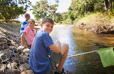 Buy stock photo Children, group and portrait or fishing at river for summer holiday at countryside for vacation, learning or travel. Kids, boys and happy with net for catch adventure at lake for bond, sun or relax