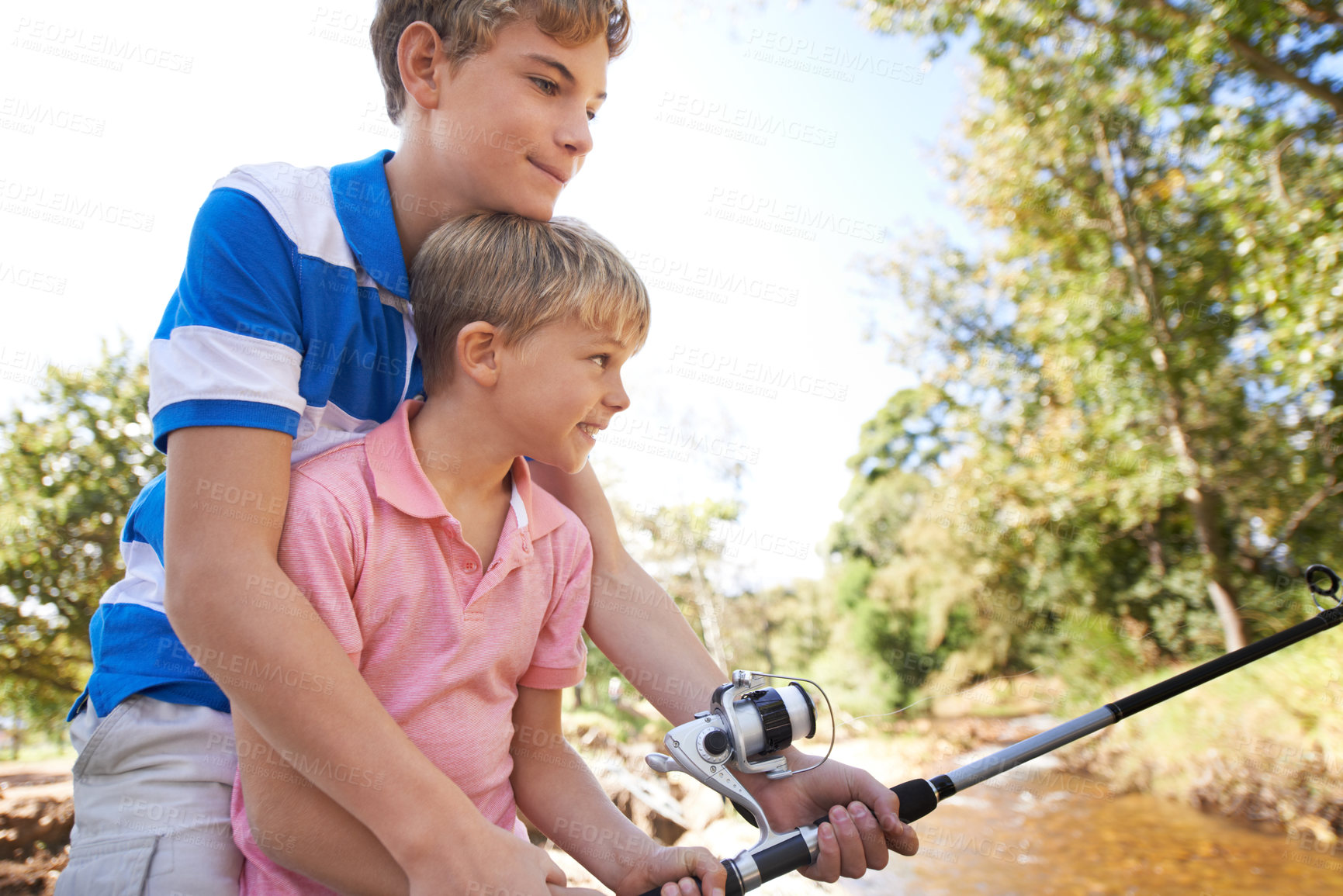 Buy stock photo Children, friends and fishing rod for teaching at river for learning or adventure, summer or reel. Male person, brothers and equipment for trout lake catch together for vacation, holiday or hobby