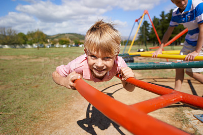 Buy stock photo Child, boy and fun on playground in portrait, smile and outdoor adventure on merry go round at park. Happy male person, carousel and energy on obstacle course, kid and playing on vacation or holiday