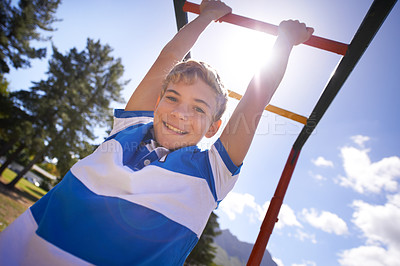 Buy stock photo Child, monkey bars and park in portrait, smiling and energy at obstacle course on outdoor adventure. Happy male person, active and exercise on jungle gym, boy and fitness on playground in Australia