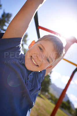Buy stock photo Child, monkey bars and smile in portrait, hanging game and obstacle course on outdoor adventure at park. Male person, active and exercise on jungle gym, boy and fitness on playground in Australia