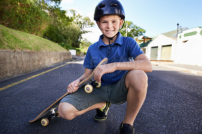 Buy stock photo A young boy with his skateboard