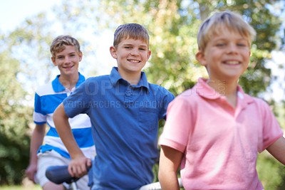 Buy stock photo Nature, happy and kids with bicycle in park learning to ride for exercise in an outdoor forest. Smile, bonding and portrait of young boy children to cycle on bike for hobby in field, woods or garden.