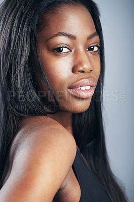 Buy stock photo A young woman in casual wear looking at the camera