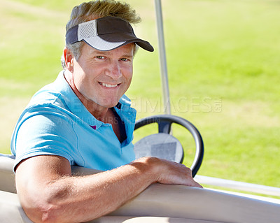 Buy stock photo Portrait of a smiling mature golfer sitting in a golf car