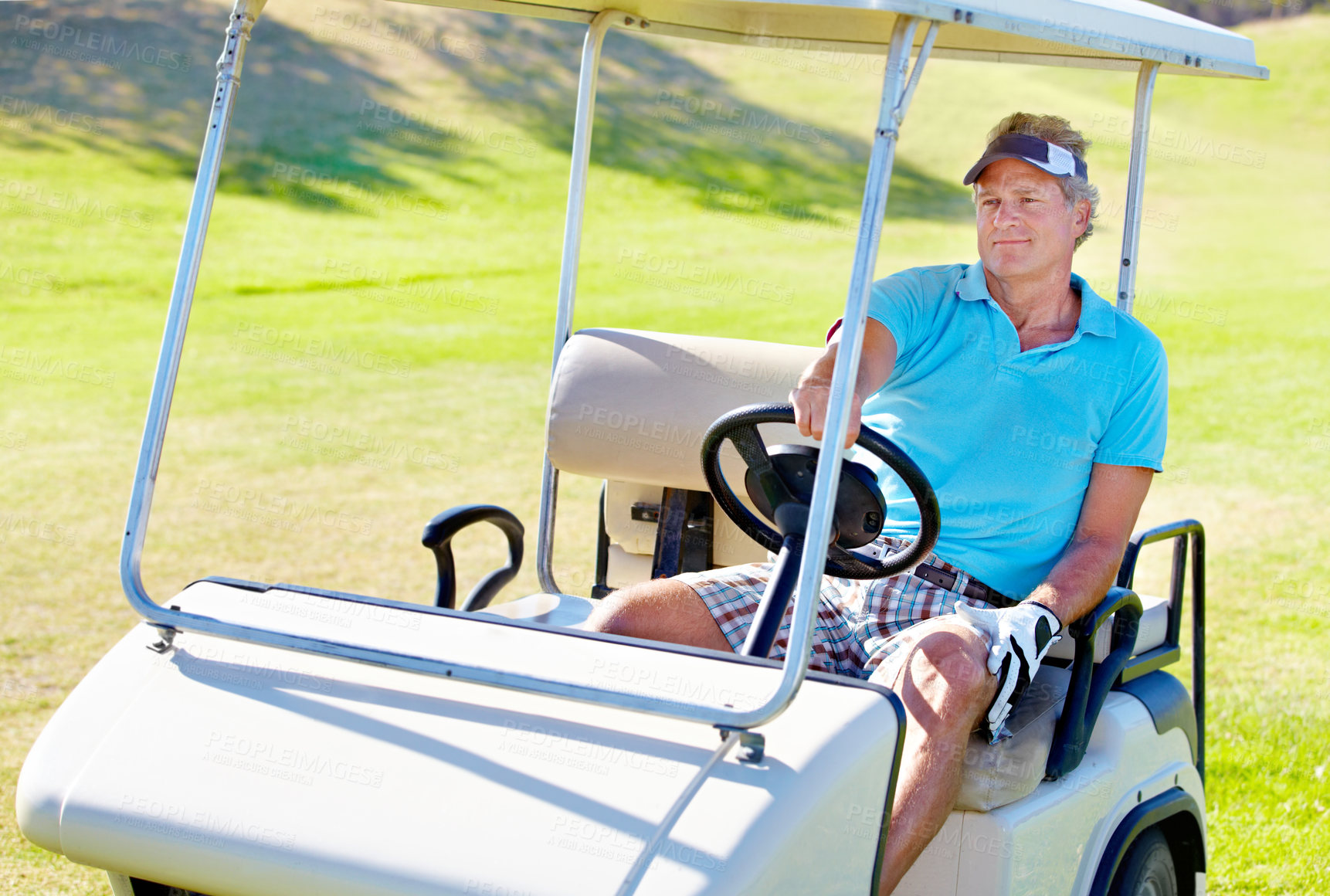 Buy stock photo Man, golf cart and relax driving on grass for sports exercise or competition, challenge or holiday. Mature person, face and field transport on course for professional training, game or tournament