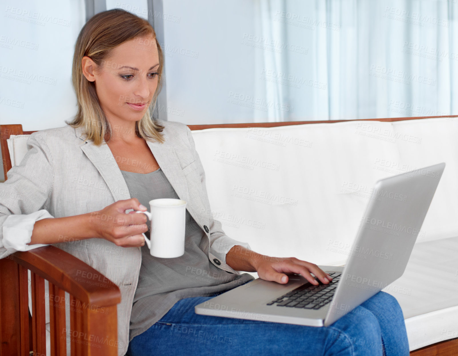 Buy stock photo Laptop, coffee and woman in home for remote work, freelance career and business in living room. House, desk and person on computer for online research, website blog and social networking for job
