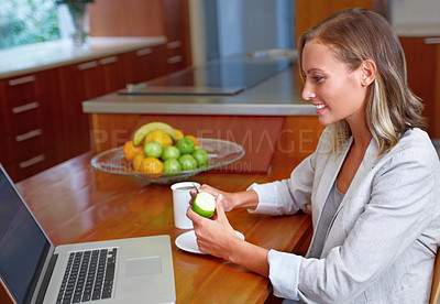 Buy stock photo Laptop, apple and business woman in home for morning routine for wellness, nutrition and healthy breakfast. Remote work, freelancer and person with fruit on computer for internet, website or research