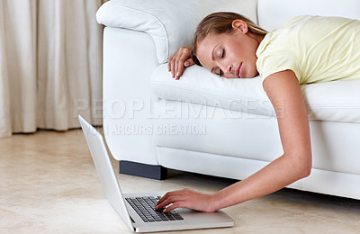 Buy stock photo Woman, couch and laptop for sleeping in home, scroll or relax with click, tired or burnout in lounge. Girl, person and lying on sofa, choice and living room with pc on floor to watch film in house