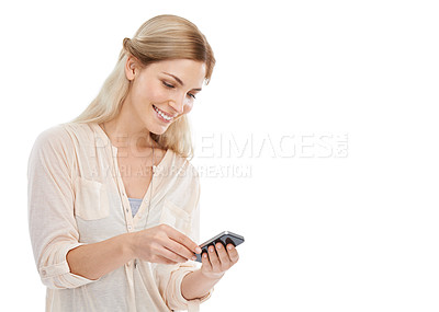 Buy stock photo Studio shot of a young woman texting on her cellphone isolated on white