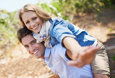 Buy stock photo Couple, portrait and piggyback in nature with freedom in relationship for holiday, vacation or travel. Romance, man and woman or happy outdoor in forest with hug for bonding, love and relax in woods