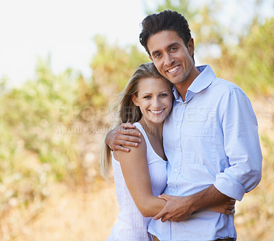 Buy stock photo Happy couple, portrait and hug in nature for embrace, bonding or love in support or outdoor affection. Face of young woman and man smile for comfort, trust or romance in forest or woods together