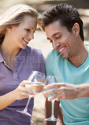 Buy stock photo Happy couple, champagne and toast outdoor for celebration of love, holiday and valentines day in park. Man and woman with wine glasses, drinks and cheers on date for success or anniversary in nature
