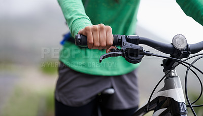 Buy stock photo Cropped shot of a cyclist on a mountain bike in the outdoors