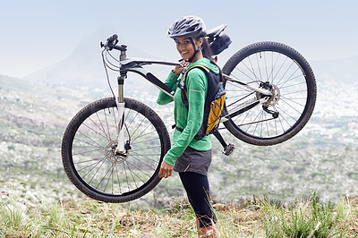 Buy stock photo A pretty young woman holding her mountain bike