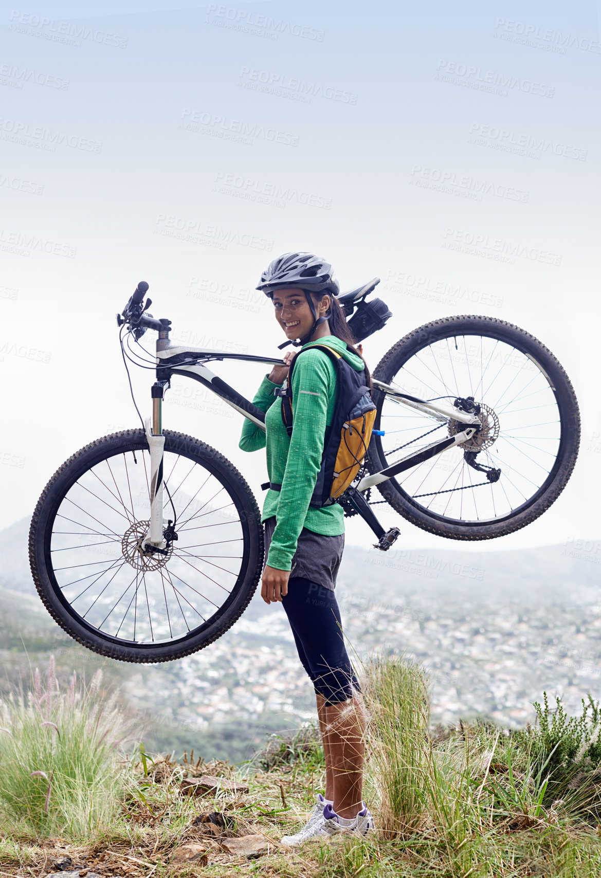 Buy stock photo Woman, holding mountain bike and smile in portrait with pride, fitness and view of cityscape from hill. Girl, person and  happy with bicycle on adventure, training or exercise for wellness in nature