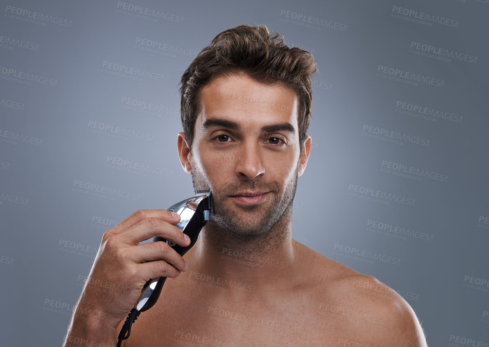 Buy stock photo Man, electric shaver and studio portrait for grooming, skincare and happy for wellness by grey background. Person, model and beard with hygiene, facial hair removal and product for cosmetic change