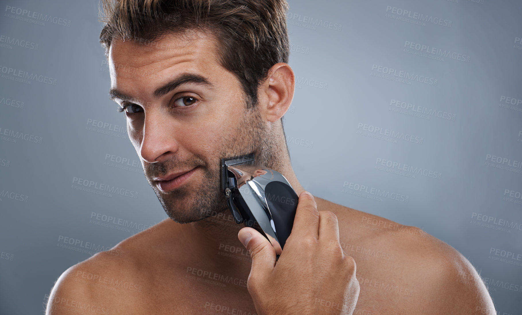 Buy stock photo Man, beard and electric razor in studio portrait for grooming, skincare and wellness by grey background. Person, model and shaving with hygiene, facial hair removal and product for cosmetic change