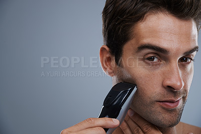Buy stock photo Man, portrait and electric razor for shaving beard or maintenance, hair removal or grey background. Male person, shirtless and tools for cleaning skin or hygiene car for confidence, studio or mockup