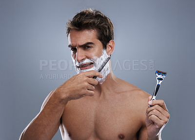 Buy stock photo Man, choice and razor in studio, shaving cream or portrait for grooming by grey background. Person, model and decision for blade with beard, facial hair removal and doubt product for cosmetic change