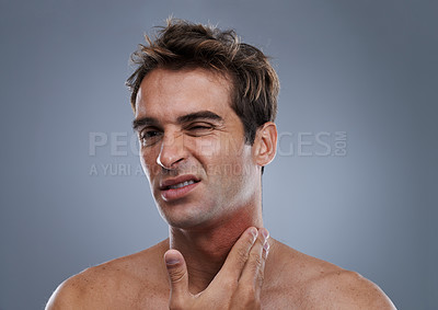 Buy stock photo Man, shave and rash pain from razor burn for hair removal for hygiene maintenance, mistake or grey background. Male person, hand and unhappy in studio or care fail in inflammation, itchy or mockup
