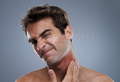 Buy stock photo Man, shave and beard rash from razor burn on grey background for skin care fail, itchy or hair removal. Male person, neck and red pain for healthy wellness or inflammation, studio or mockup space