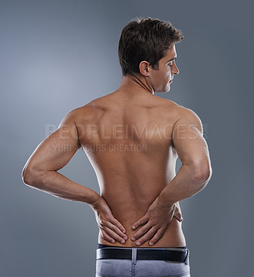 Buy stock photo Back pain, injury crisis and studio man with medical emergency, sore spine or osteoporosis. Backache, anatomy and person massage joint ache, accident or hurt muscle strain on grey background