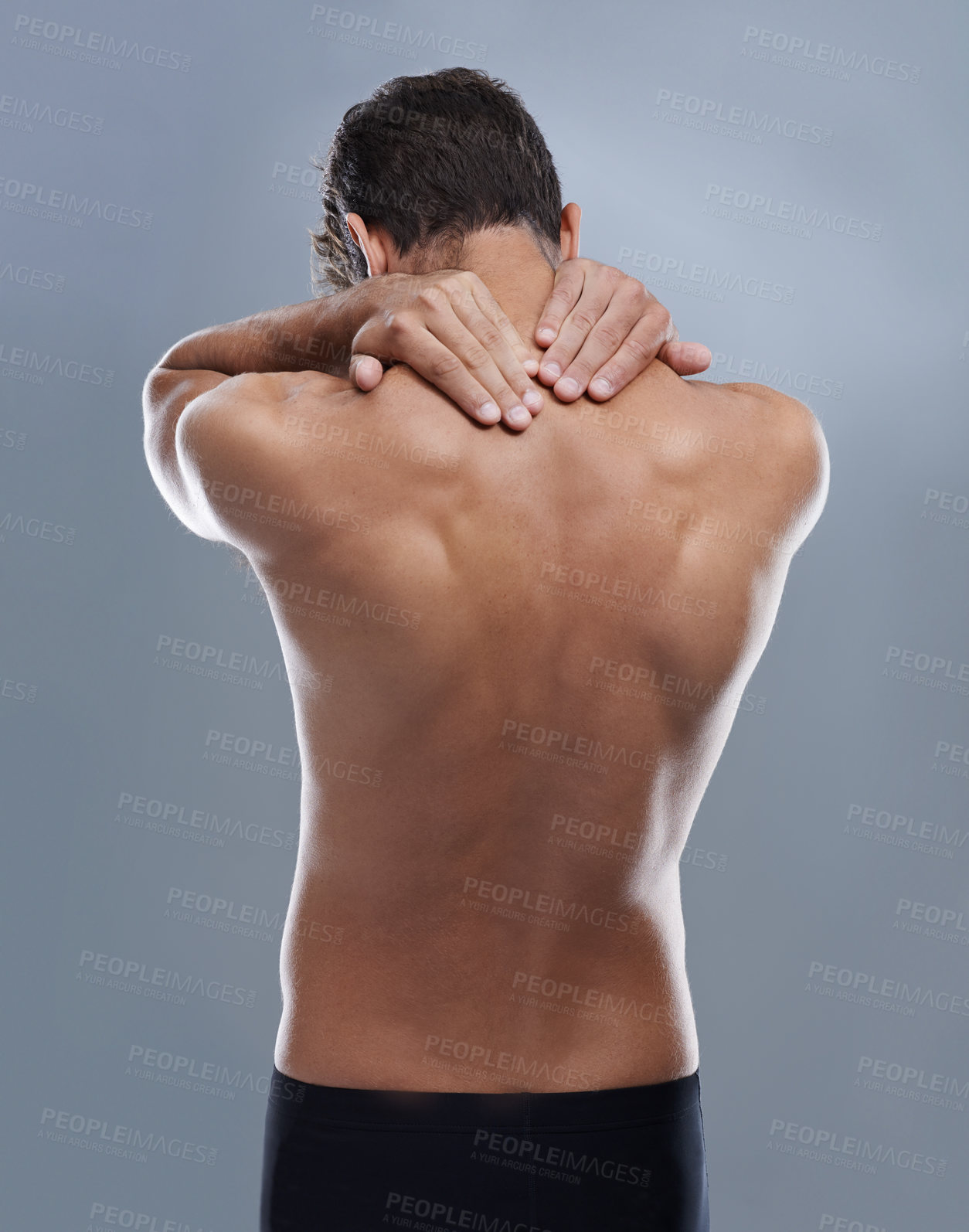 Buy stock photo Back pain, injury problem and studio person with medical emergency, sore backbone or osteoporosis. Backache, spine risk and model with body ache, fibromyalgia or hurt muscle strain on grey background