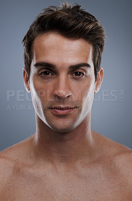 Buy stock photo Portrait, skincare and man with cosmetics, wellness and confident guy on grey studio background. Face, person and model with beauty or grooming with routine or dermatology with healthy skin or glow