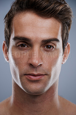 Buy stock photo Portrait, skincare and man with cosmetics, dermatology and confident guy on grey studio background. Face, person or model with beauty or grooming with routine or aesthetic with healthy skin or glow