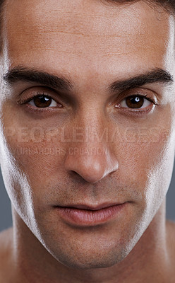 Buy stock photo Portrait, skincare and man with cosmetics, closeup and dermatology on grey studio background. Face, person or model with beauty or grooming with routine or wellness with glow, aesthetic and self care