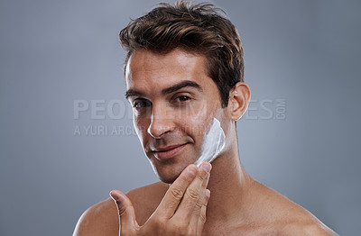Buy stock photo Portrait, shave cream and man with skincare, cosmetics and beauty on a grey studio background. Face, person and model with grooming routine and treatment with beard and moisture with wellness