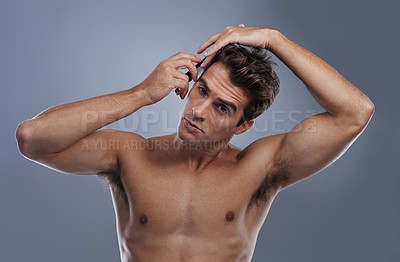 Buy stock photo Man, portrait and comb hair in studio for grooming style on grey background for hygiene, self care and shirtless. Male person, model and face with brush for routine in morning, health or mockup space