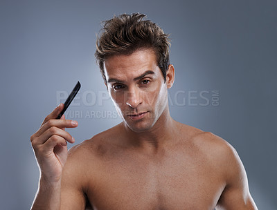 Buy stock photo Man, portrait and comb hair for style or grooming on grey background for hygiene, self care and shirtless. Male person, model and face with brush for routine in morning, confidence or mockup space