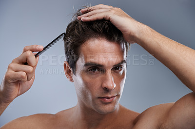 Buy stock photo Man, portrait and comb hair for grooming style on grey background for hygiene, self care and shirtless. Male person, model and face with brush for routine in morning or health, studio or mockup space