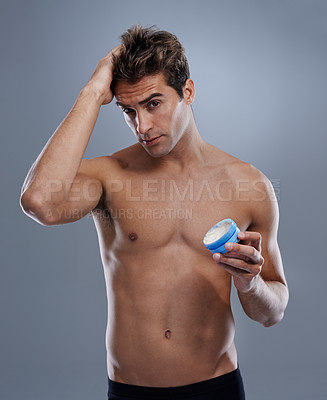 Buy stock photo Studio, portrait and model with gel for hair care, cream and shine for styling or salon product. Man, face or happy for conditioner for male beauty or keratin treatment for growth by gray background