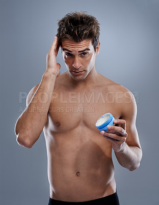 Buy stock photo Studio, portrait and man with gel for hair care, cream and shine for styling or salon product. Model, face or happy for conditioner for male beauty or keratin treatment for growth by gray background