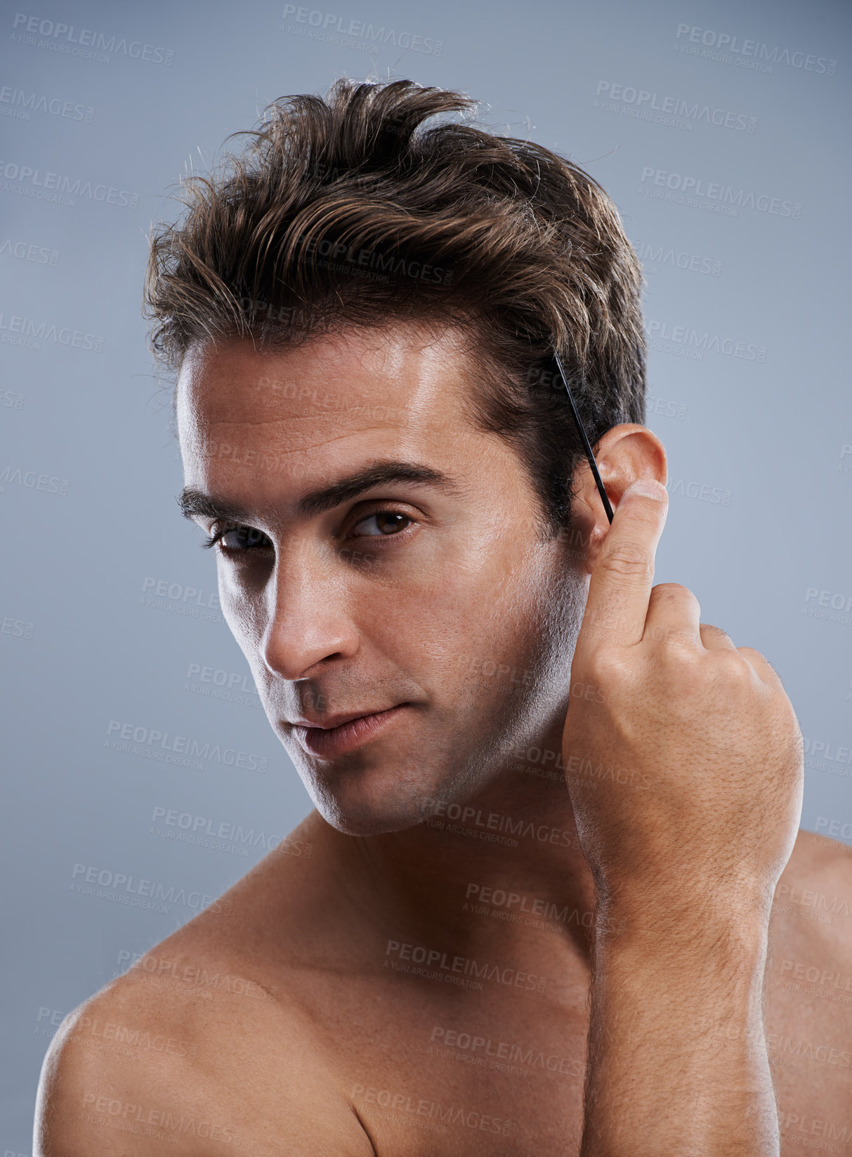 Buy stock photo Hair, studio and portrait of man with comb for wellness routine, grooming treatment or haircut styling. Self care tools, spa salon and face of aesthetic model with hairstyle brush on grey background