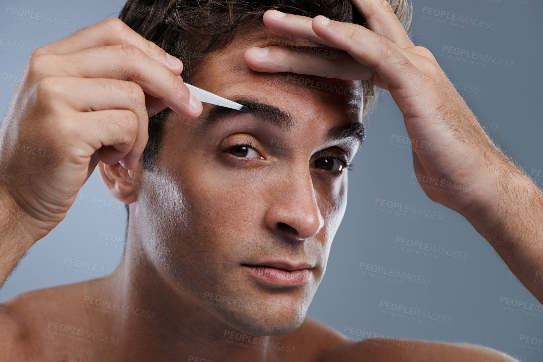 Buy stock photo Man, portrait and tweezers for eyebrows or pluck for face clean, hygiene or grey background. Male person, grooming and hair removal for healthy morning routine or studio, treatment or mockup space