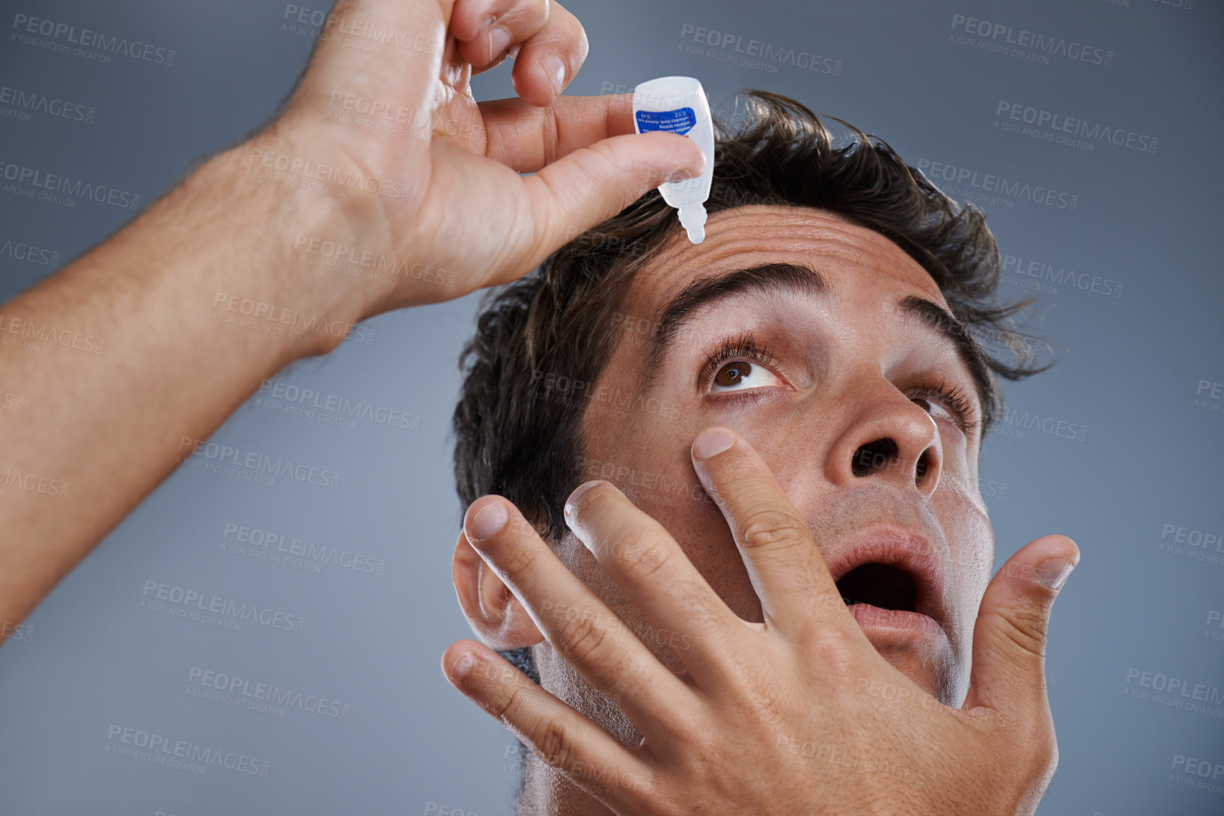 Buy stock photo Man, eye drops and vision for allergies care in studio or healthcare wellness, liquid or grey background. Male person, solution and conjunctivitis dropper for clean pupil or dry, irritation or mockup