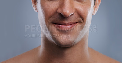 Buy stock photo Man, mouth and smile with skincare and lips with hygiene, jawline and satisfaction with treatment closeup. Grooming, confidence and face with male model in studio background for cosmetic shave