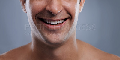 Buy stock photo Man, mouth and smile with skincare and lips with hygiene, jawline and satisfaction with treatment closeup. Grooming, confidence and cropped with male model in studio background for cosmetics