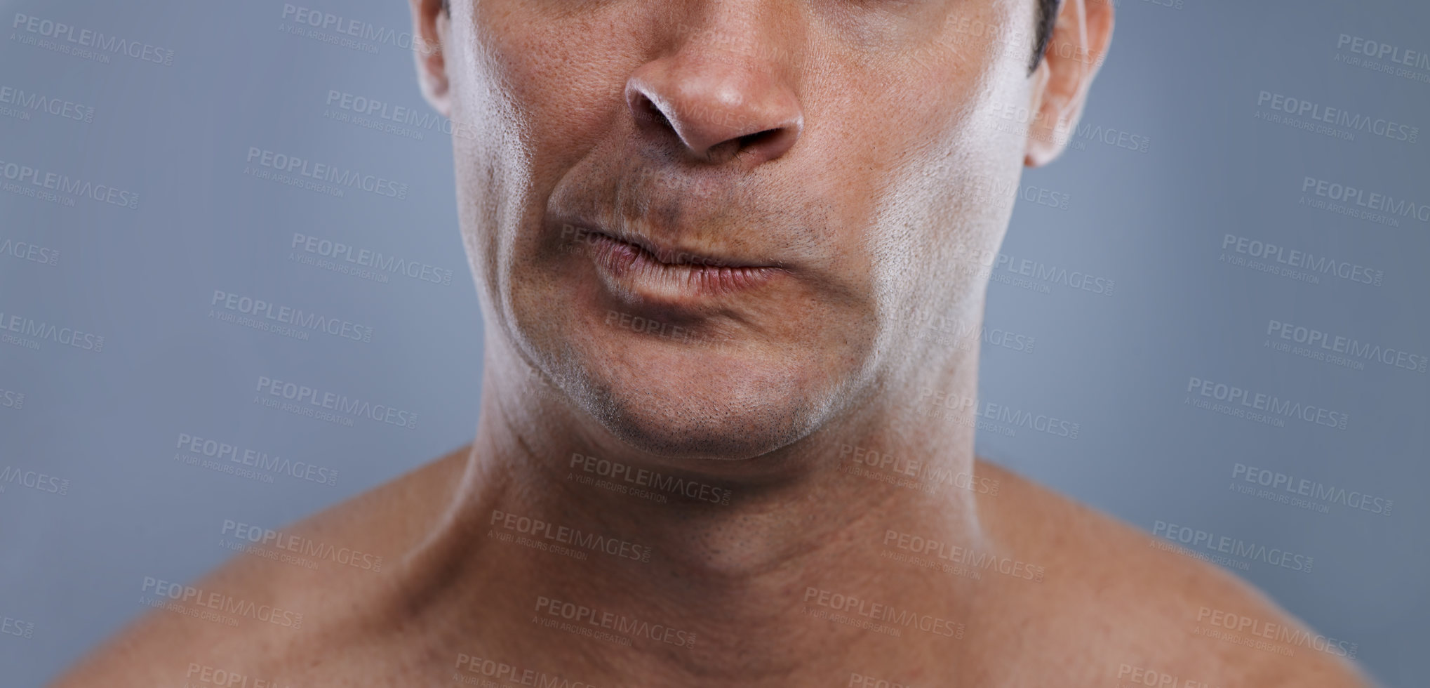 Buy stock photo Man, mouth and angry with shave, face and hygiene with skincare, upset, and frustrated with treatment closeup. Grooming, mockup space and moody with male model in studio background with cosmetics