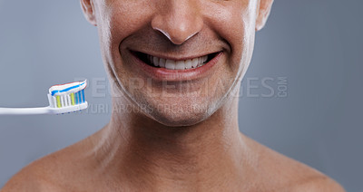 Buy stock photo Studio, portrait and person with toothpaste for teeth, oral hygiene and toothbrush for dental cleaning. Model, healthy smile or orthodontics healthcare of whitening or fresh breath by gray background