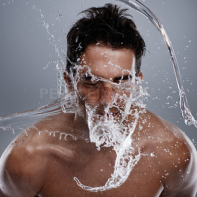 Buy stock photo Water drops, splash and man wash face for bathroom routine, self care or beauty treatment. Studio, bathing and male model with facial cleanse for hygiene, grooming and clear skin on grey background