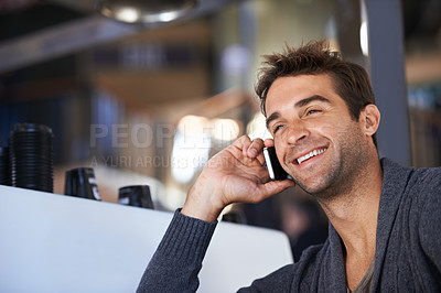 Buy stock photo Phone call, happy and young man networking for deal, good news or work communication in cafe. Smile, satisfaction and male person on mobile conversation with cellphone for career in coffee shop.