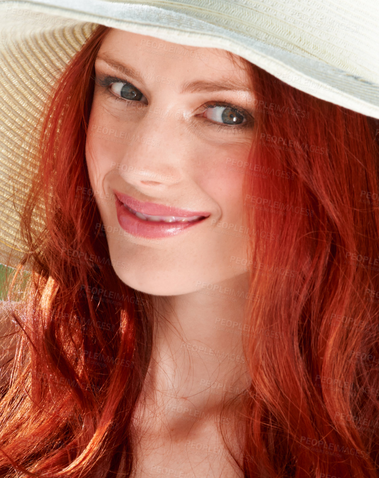 Buy stock photo A young redheade woman wearing a sunhat